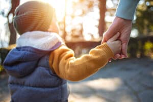 Child holding a grown up's hand