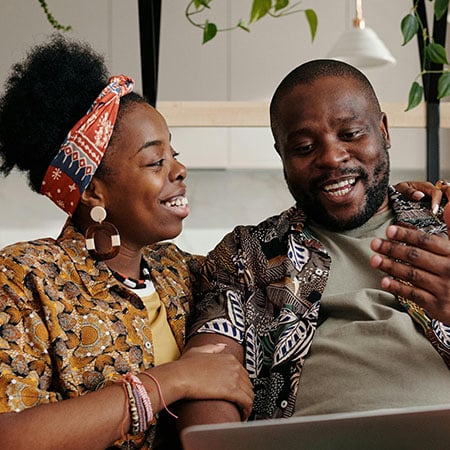 Couple deciding about adoption on couch